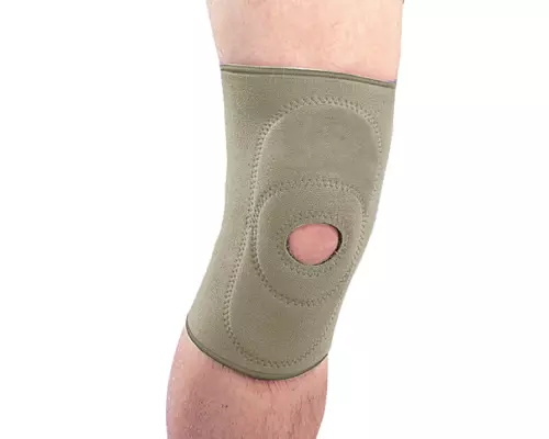 Бандаж на колінний суглоб неопреновий з пателярним кільцем Ortop NS-703 р.S бежевий